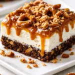 Caramel Ribbon Crunch Bars with a crispy golden base, thick caramel ribbons, and a chocolate drizzle on a white plate.
