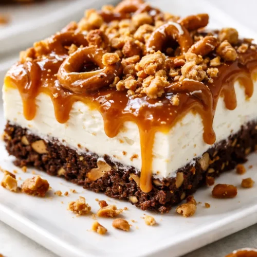 Caramel Ribbon Crunch Bars with a crispy golden base, thick caramel ribbons, and a chocolate drizzle on a white plate.