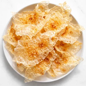 Crispy air fryer rice paper chips with golden brown edges and a shatteringly crunchy texture.