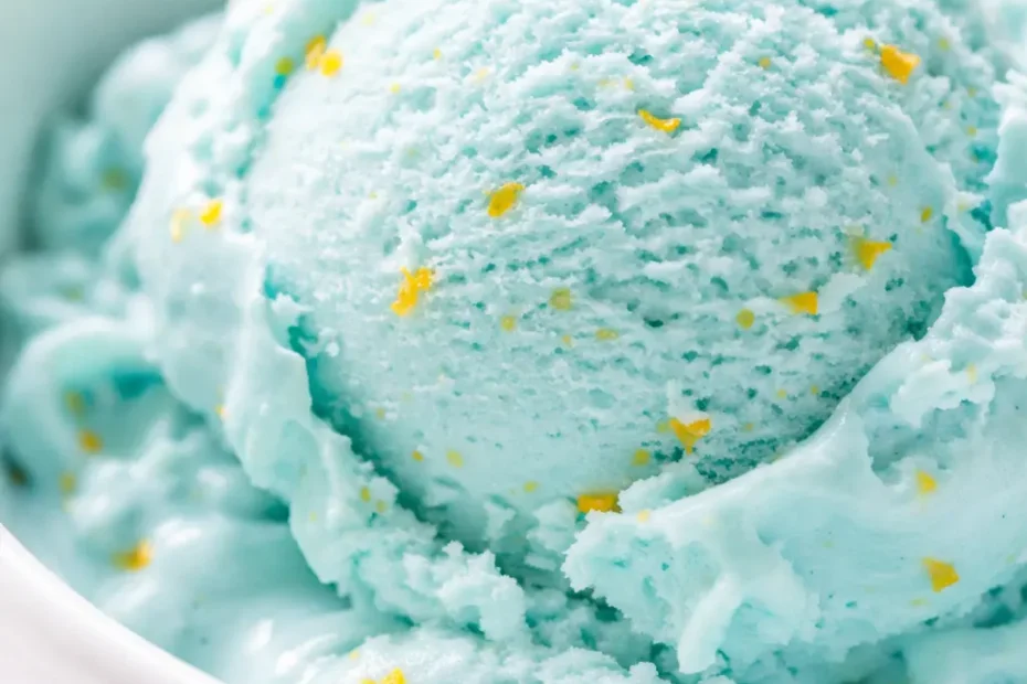 Vibrant blue scoop of creamy ice cream in a bowl, capturing the authentic flavor of the Midwest original blue moon ice cream recipe.