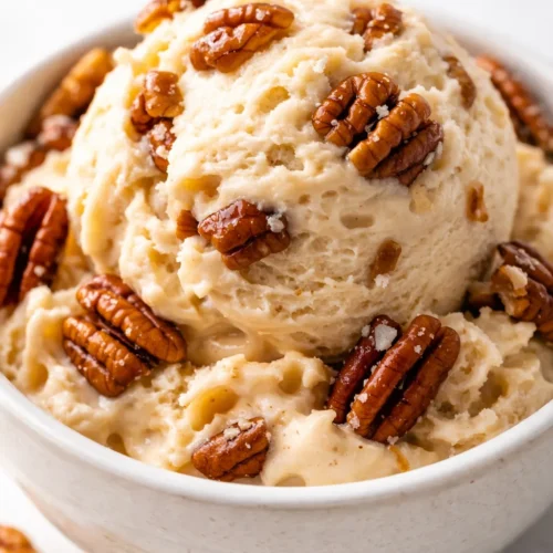 Rich and creamy homemade butter pecan ice cream with golden toasted pecans, smooth custard base, and glossy finish.