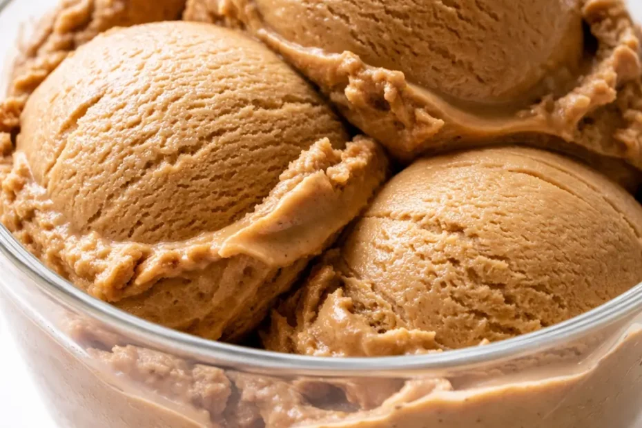 Scoop of no-churn bold coffee ice cream with silky texture and deep espresso color, garnished with coffee beans.