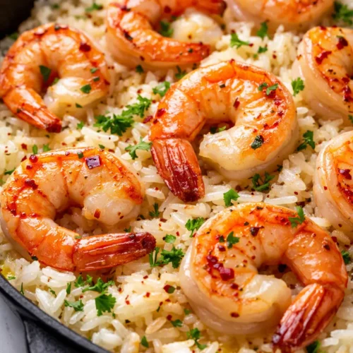 Creamy garlic butter shrimp and rice with plump shrimp in a rich, silky sauce over fluffy white rice.